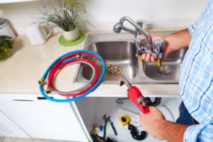 depositphotos 61515887 stock photo plumber on the kitchen